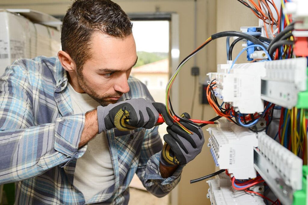 Electrician-working-on-switchboard-of-house-building-construction-site