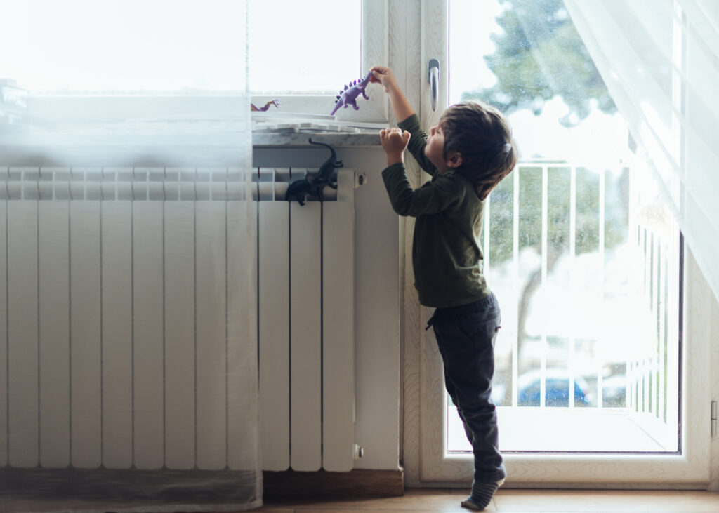 kid-playing-with-toy-dinosaurs